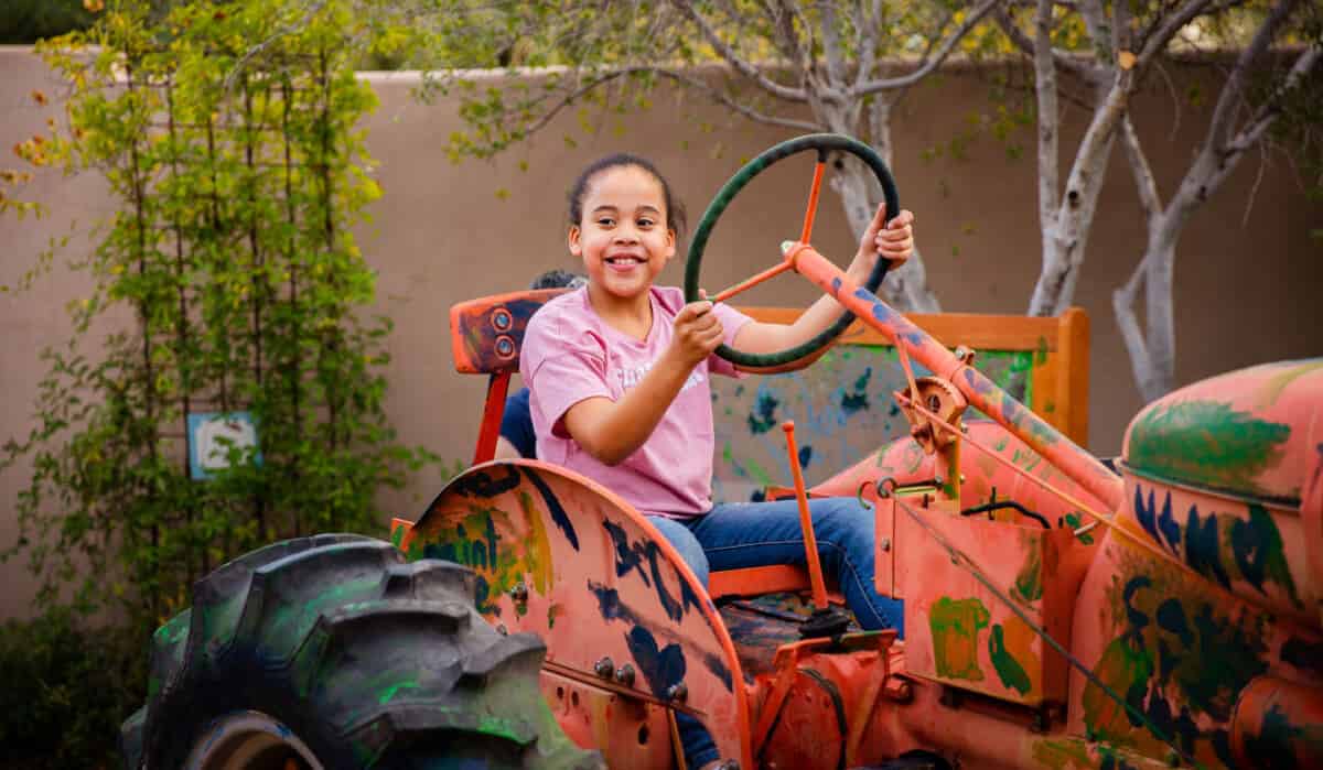 Girl Driving Tractor Childrens Museum Oro Valley Tohono Chul | Children's Museum Oro Valley at Tohono Chul - Attraction Guide