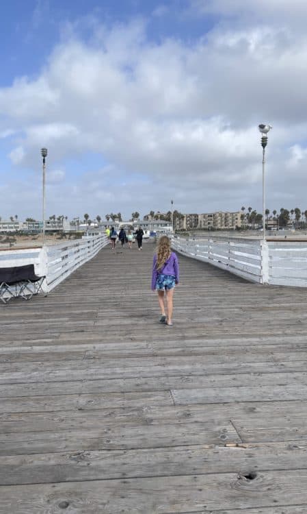 Pacific Beach Deck Girl Walking | ROAD TRIP: Tucson to San Diego