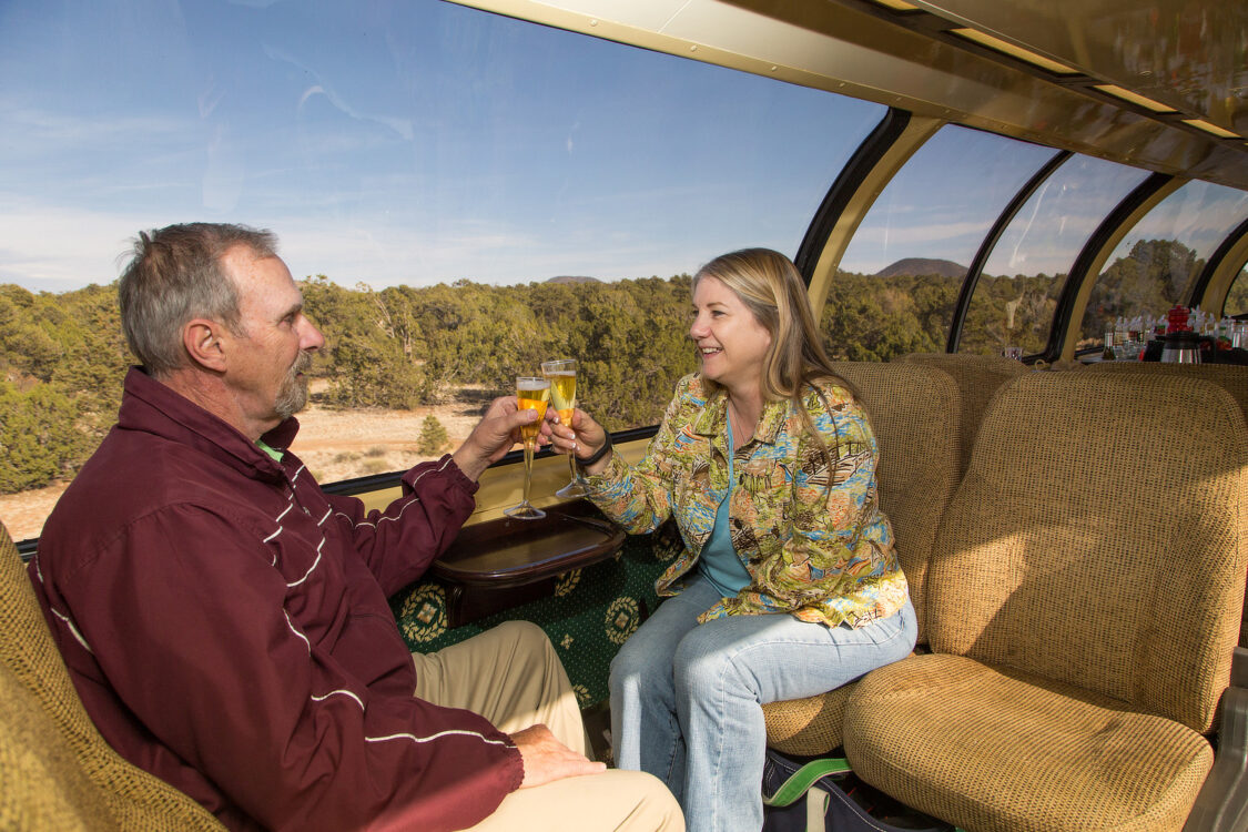 Grand Canyon Railway Lux Dome Couple Champagne Toast | ROAD TRIP: Tucson to Grand Canyon Railway